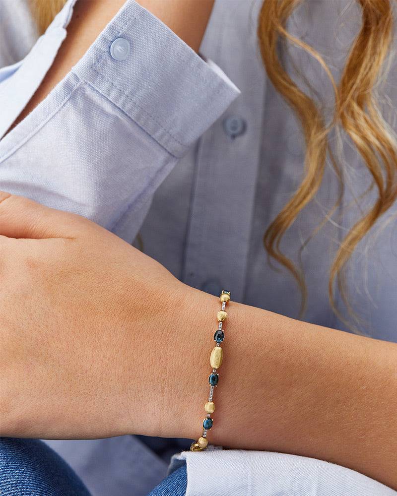 Nanis Bracciale tennis "DANCING AZURE" in oro, diamanti e topazio London blu – Nanis Italian Jewels Negozio